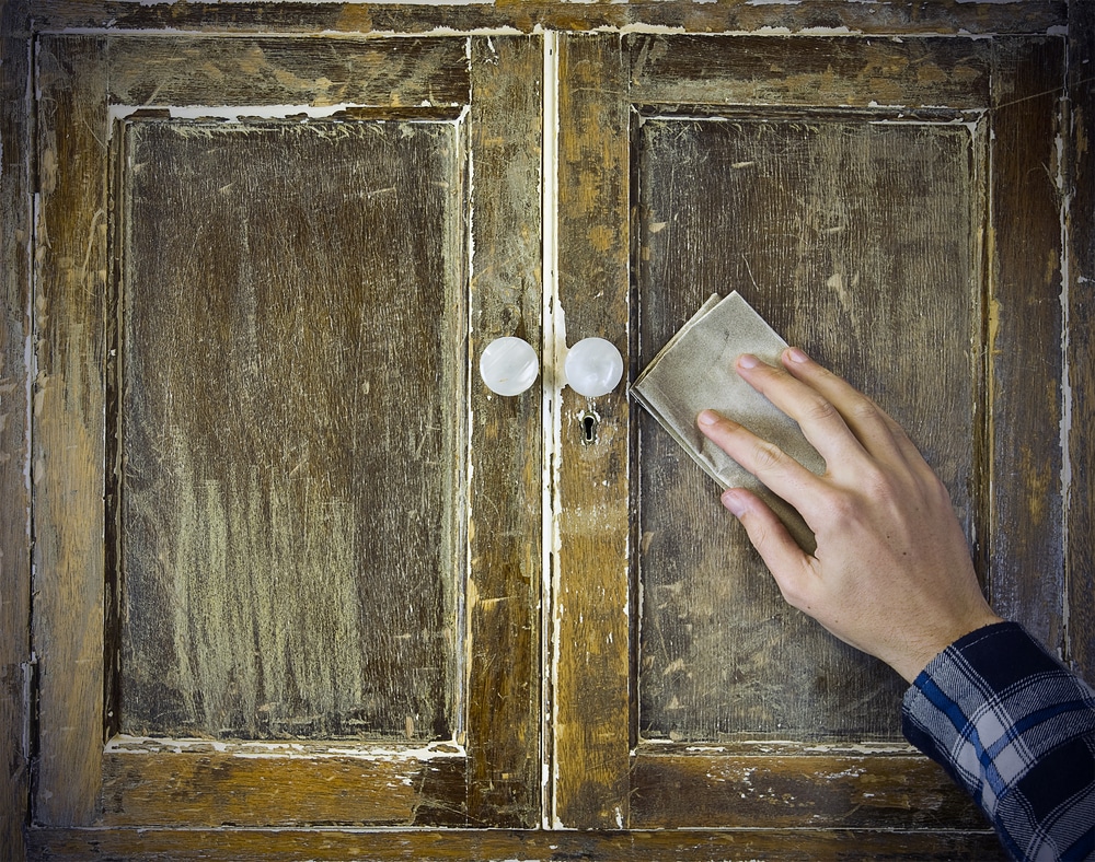 Restoration Removing Paint From Antique Cabinet With Sandpaper