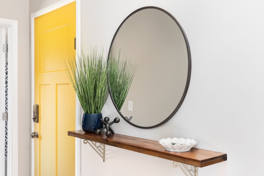 A Cozy Entryway A Bright Yellow Front Door Decorations On