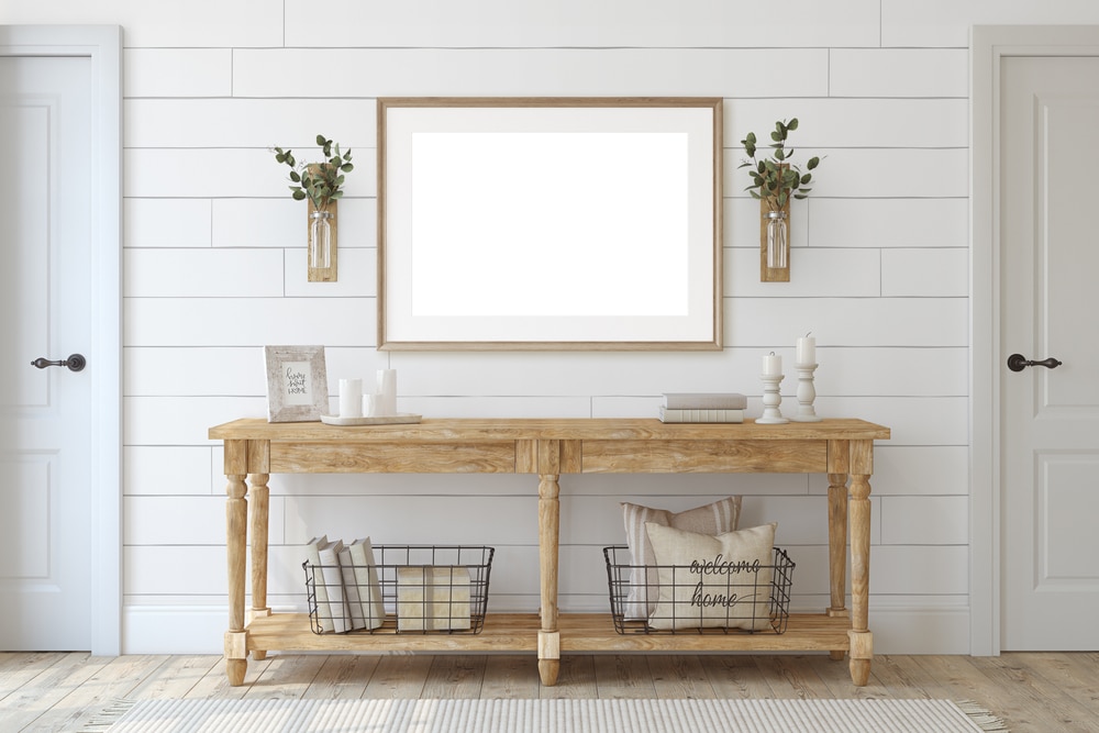 Farmhouse entryway wooden console table near white wall