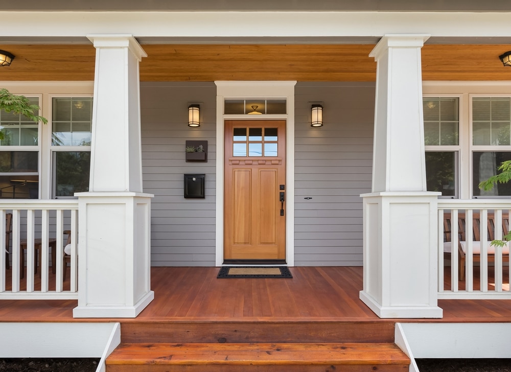 Front Door And Covered Porch Of New Home Exterior: Solid