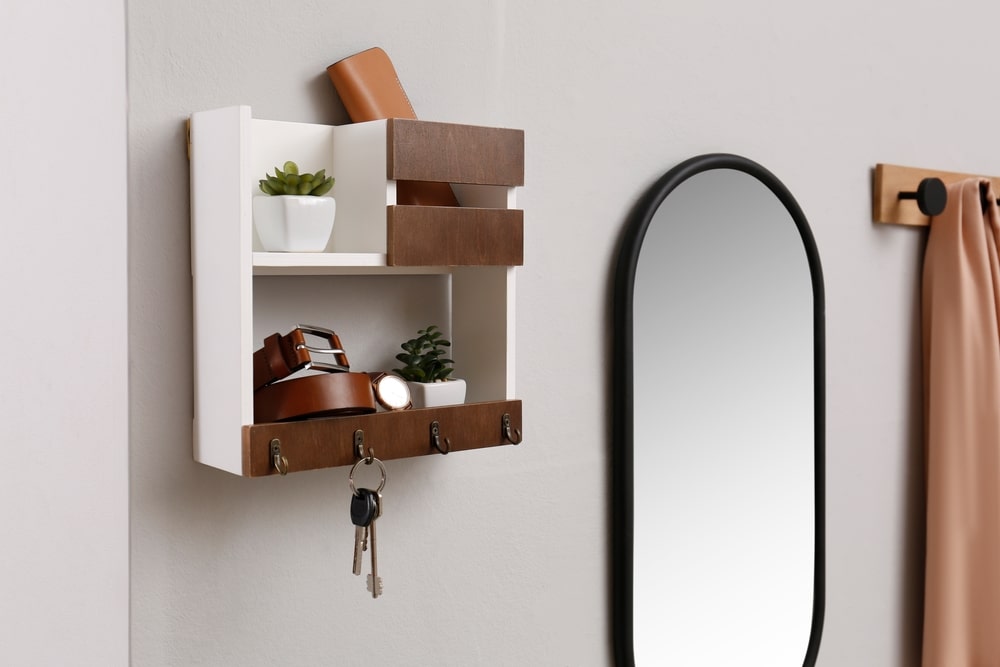 Hallway Interior With Stylish Accessories And Wooden Hanger For Keys