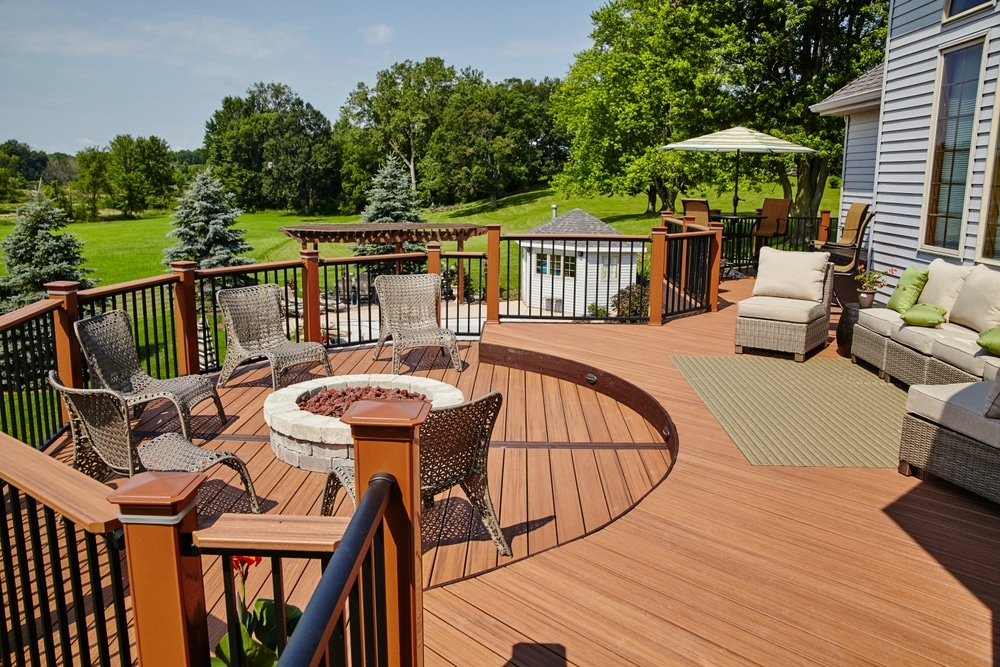 Luxury Outdoor Deck With Fire Pit Seating And Rattan Lounge