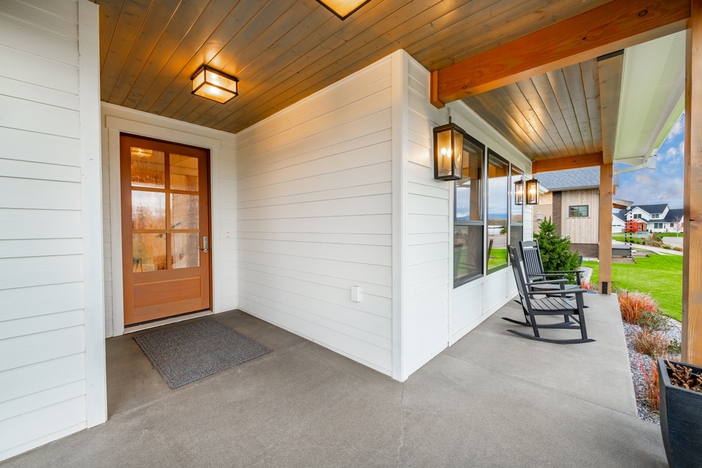 Front Veranda Porch Of A Modern Farmhouse Style Home With