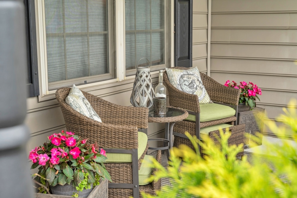 On The Patio Discover A Delightful Scene Featuring Two Chairs